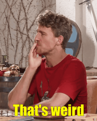 Man Sitting At Table Saying That's Weird GIF