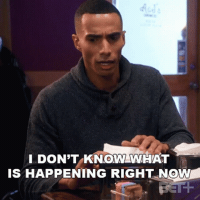 Man Sitting At Table Says I Don't Know What Is Happening Right Now GIF