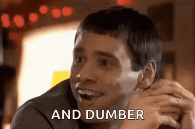 Man Sitting At Table Smiling Hands Folded GIF