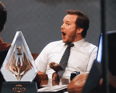 Man Sitting At Table With Attack Trophy GIF