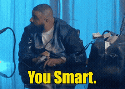 Man Sitting At Table With Bag Saying You Smart GIF