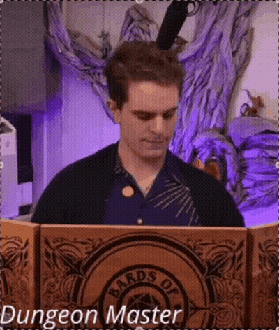 Man Sitting At Table With Bards Of Dungeon Master Box GIF