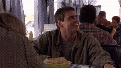 Man Sitting At Table With Basket Of Food GIF