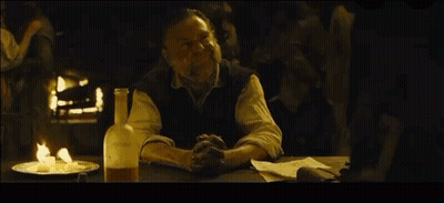 Man Sitting At Table With Beer And Food GIF