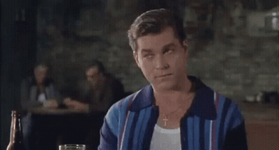 Man Sitting At Table With Beer Bottle And Glass GIF