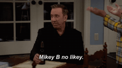 Man Sitting At Table With Beer Saying Mikey B No Likey GIF