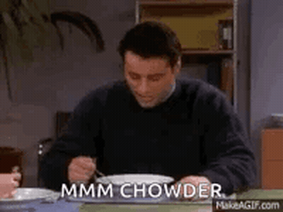 Man Sitting At Table With Bowl Of Soup And Fork GIF