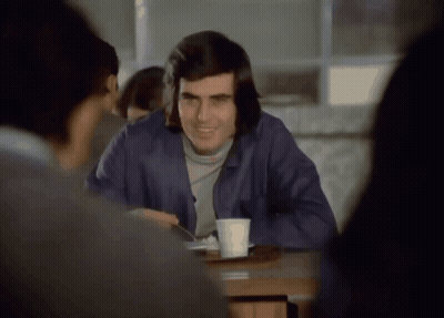 Man Sitting At Table With Coffee GIF