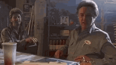 Man Sitting At Table With Coffee And Watch GIF