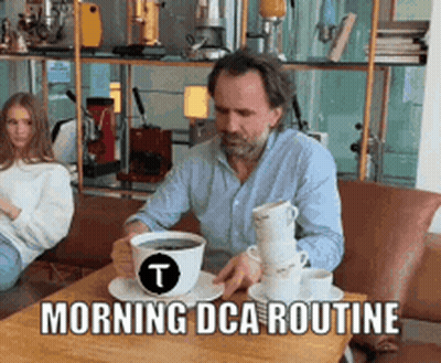 Man Sitting At Table With Coffee Cups Morning Dca Routine GIF