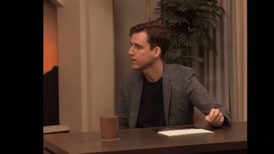 Man Sitting At Table With Coffee GIF