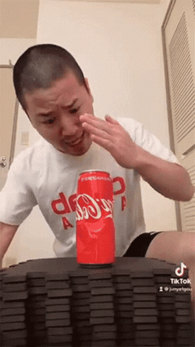 Man Sitting At Table With Dominoes And Coca-Cola GIF