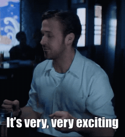 Man Sitting At Table With Drink Saying It's Very Very Exciting GIF