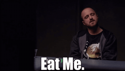 Man Sitting At Table With Eat Me GIF