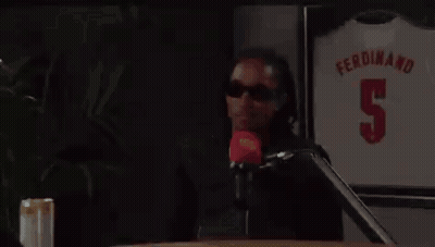 Man Sitting At Table With Ferdinand 5 Jersey GIF