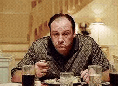 Man Sitting At Table With Food And Soda GIF