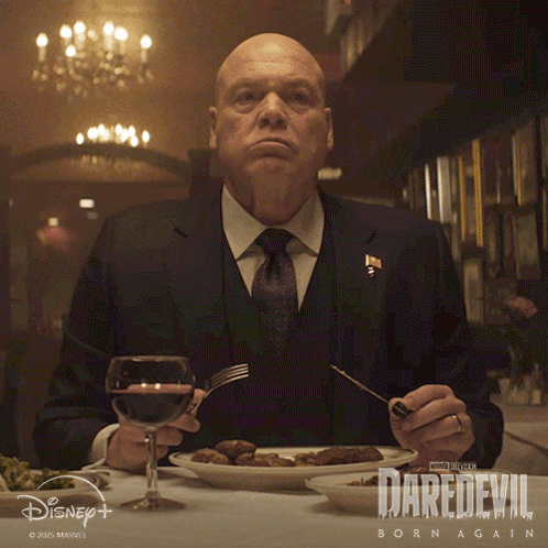 Man Sitting At Table With Food And Wine GIF