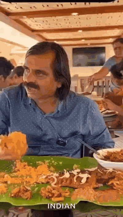 Man Sitting At Table With Food GIF