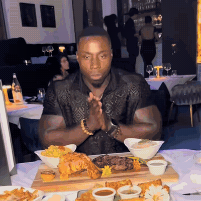 Man Sitting At Table With Food GIF