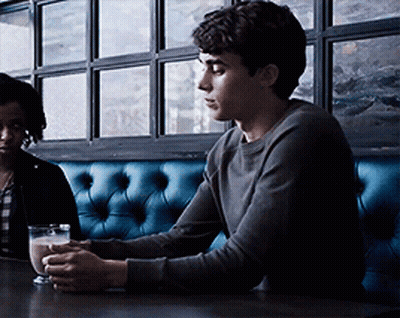 Man Sitting At Table With Glass Of Water GIF