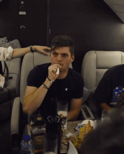 Man Sitting At Table With Gummy Bears GIF