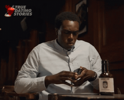Man Sitting At Table With John's Gin GIF