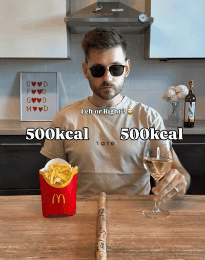 Man Sitting At Table With McDonald's Box And Glass Of Wine GIF
