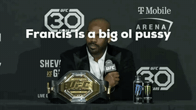 Man Sitting At Table With Microphone And UFC Belt GIF