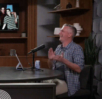 Man Sitting At Table With Microphone And Yes GIF
