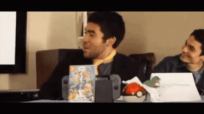 Man Sitting At Table With Nintendo Switch And Game GIF