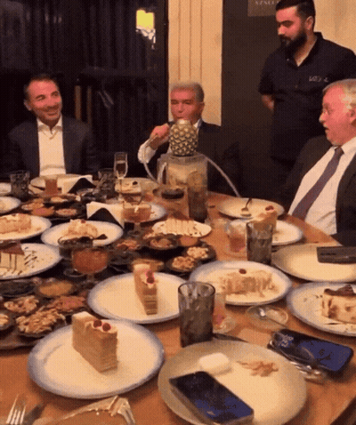 Man Sitting At Table With Pineapple GIF