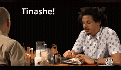 Man Sitting At Table With Plate Of Food Saying Tinashe GIF