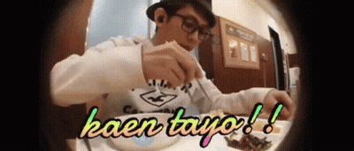 Man Sitting At Table With Plate Saying Kaen Tayo GIF