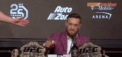 Man Sitting At Table With Proper Twelve Bottle GIF