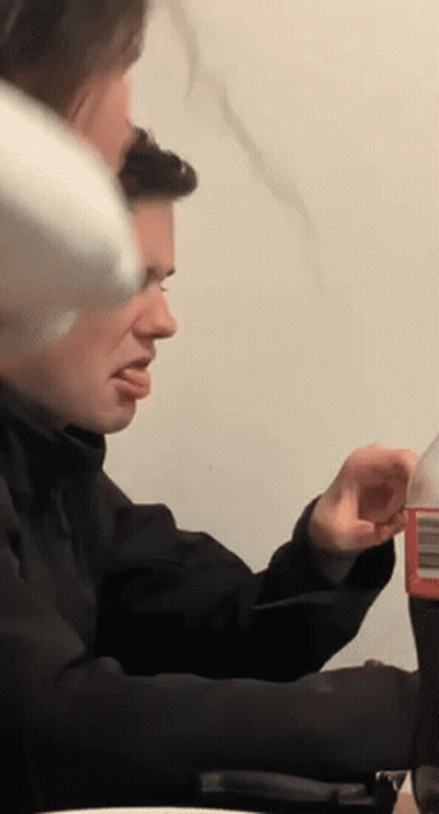 Man Sitting At Table With Soda GIF