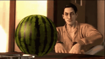Man Sitting at Table With Watermelon