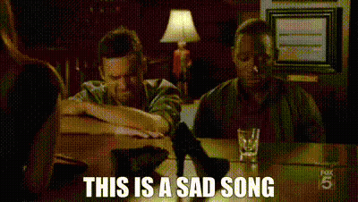 Man Sitting At Table With Whiskey And Food GIF