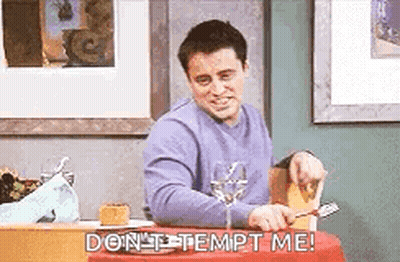 Man Sitting At Table With Wine And Knife GIF
