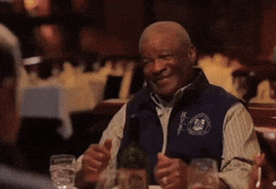 Man Sitting At Table With Wine Bottle GIF