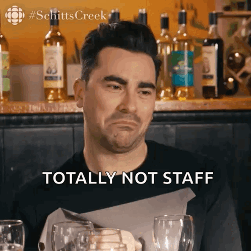 Man Sitting At Table With Wine Totally Not Staff GIF