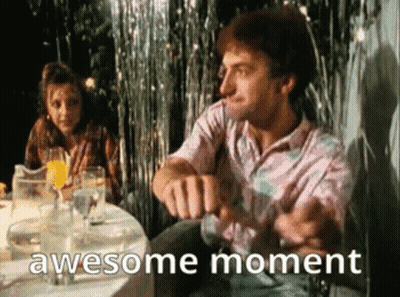 Man Sitting At Table With Woman Behind GIF