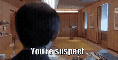 Man Sitting At Table You're Suspect GIF