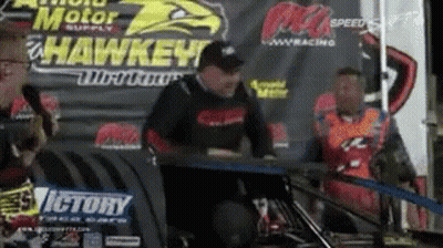 Man Sitting At Victory Sign GIF
