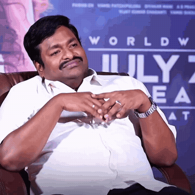 Man Sitting Before World July 7Th Sign GIF