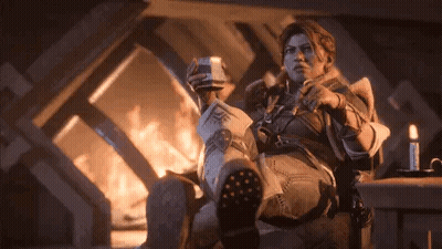 Man Sitting By Fireplace Holding Newspaper And Coffee GIF