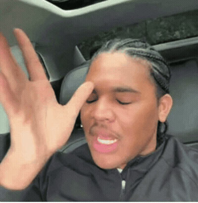 Man Sitting In Back Seat Of Car Making Funny Face GIF