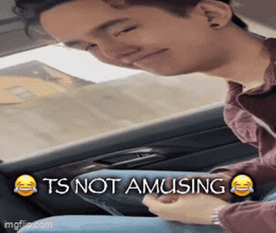 Man Sitting In Back Seat Says It's Not Amusing GIF