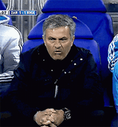 Man Sitting In Blue Chair With Zar Sign GIF