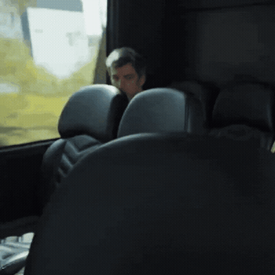 Man Sitting In Bus Looking Out Window GIF