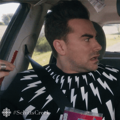Man Sitting In Car In Black And White Lightning Bolt Sweater GIF